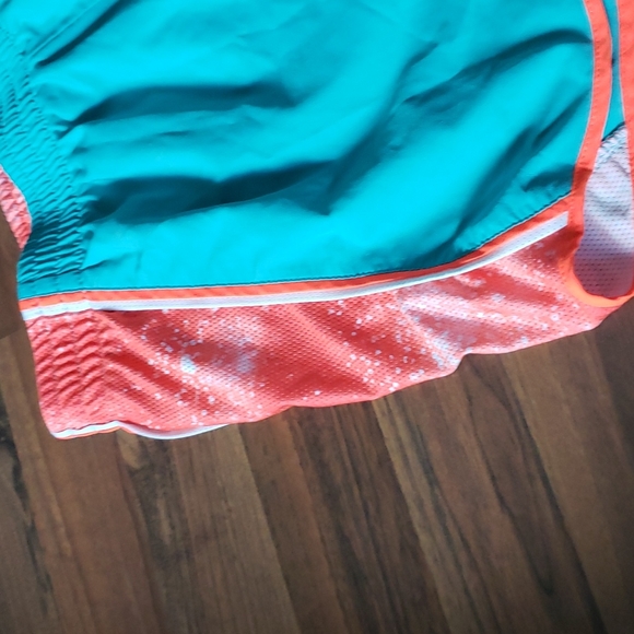 Women's Nike Dri-Fit shorts Dark Mint Green with Orange trim - Picture 2 of 7